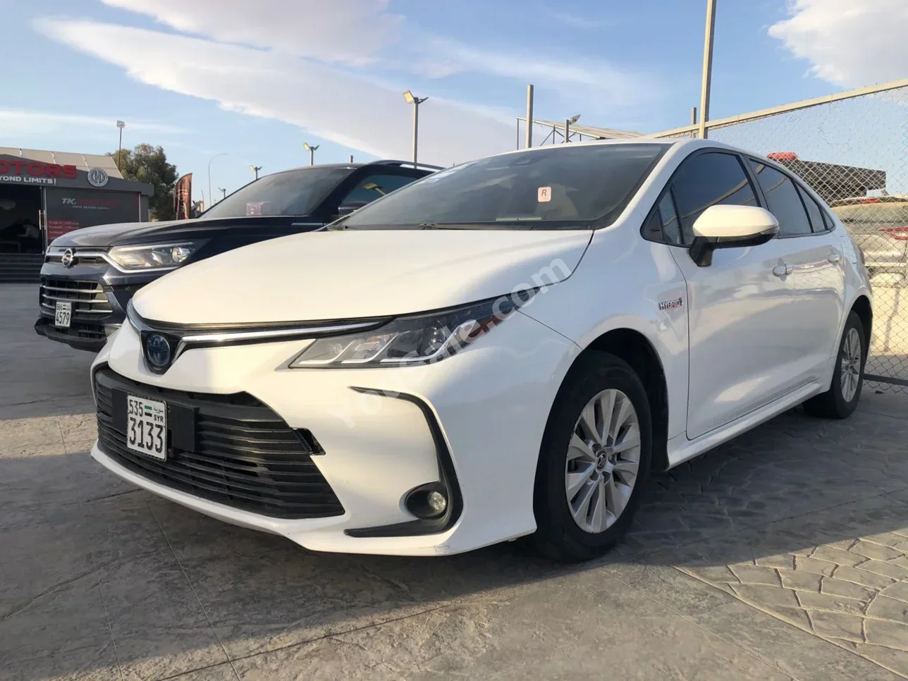 Toyota Corolla 2020 Automatic 63,000 km 4 Cylinder FWD Sedan White Hybrid