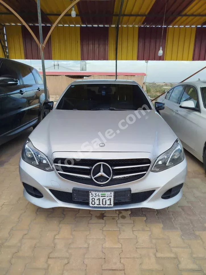 Mercedes-Benz  E-Class  220  2015  Automatic  130,000 km  4 Cylinder  RWD  Sedan  Silver  Diesel
