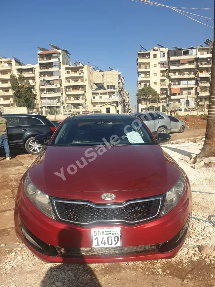 Kia  Optima  2012  Automatic  215,000 km  4 Cylinder  FWD  Sedan  Red  Gasoline