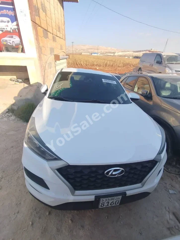Hyundai  Tucson  2019  Automatic  90,000 km  4 Cylinder  FWD  SUV  White  Gasoline