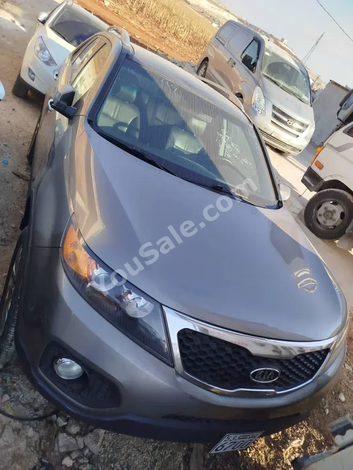 Kia  Sorento  2010  Automatic  300,000 km  4 Cylinder  FWD  SUV  Dark Gray  Gasoline
