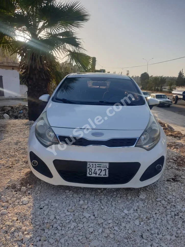 Kia  Rio  2014  Automatic  140,000 km  4 Cylinder  FWD  Hatchback  White  Gasoline