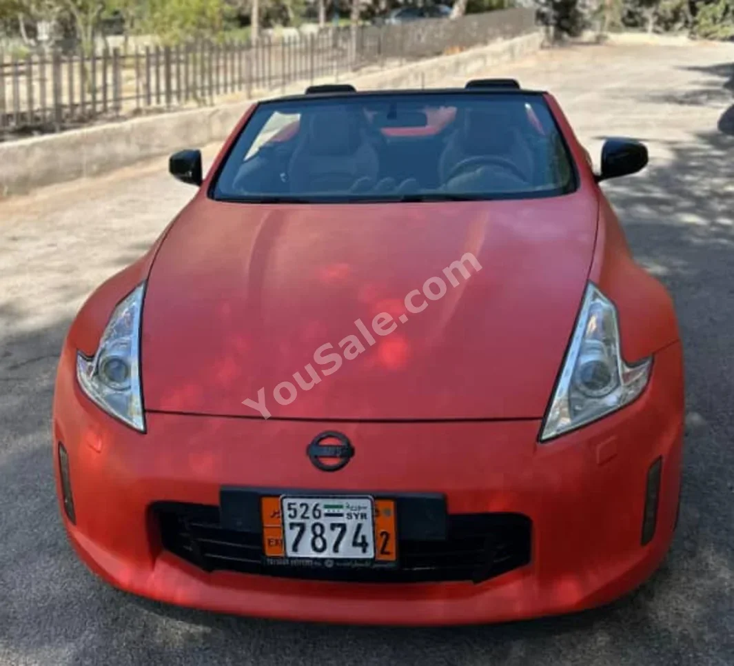 نيسان  زد  زد اكس  2015  اتوماتيك  198,000 كم  6 سلندر  دفع خلفي  كوبيه \ سبورت  برتقالي  بنزين