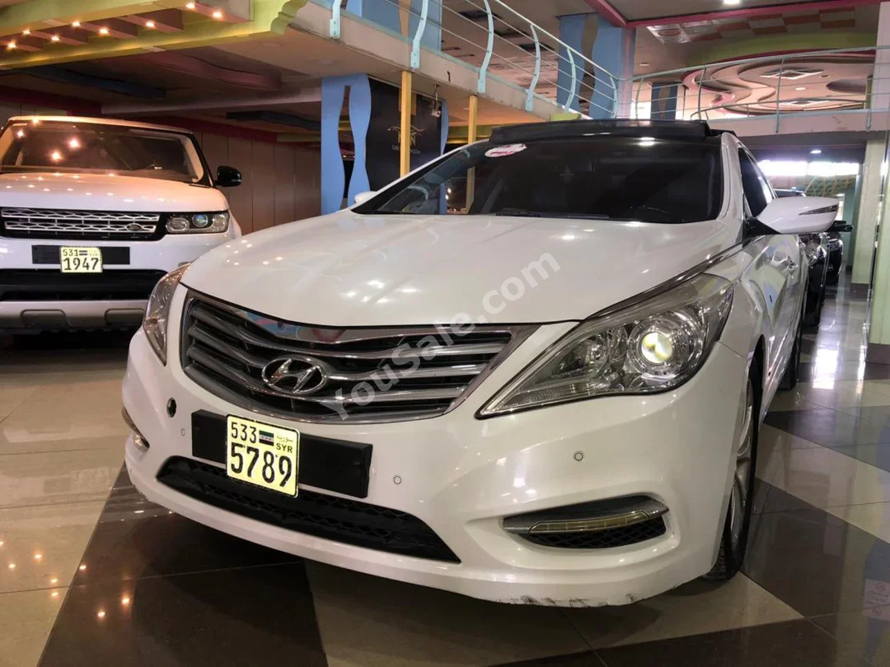 Hyundai  Azera  2012  Automatic  180,000 km  4 Cylinder  FWD  Sedan  White  Gasoline