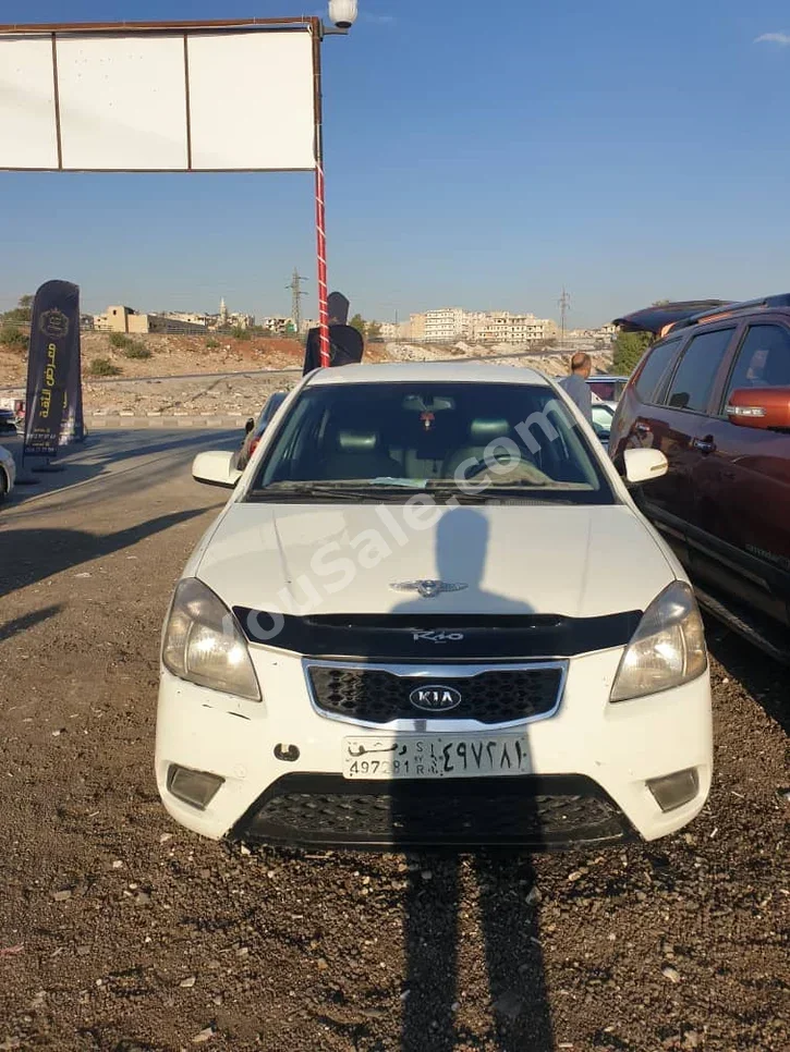 Kia  Rio  2010  Automatic  516,000 km  4 Cylinder  FWD  Sedan  White  Gasoline