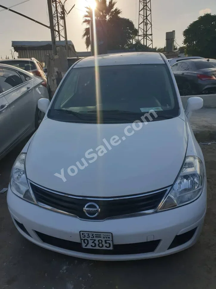 Nissan  Tiida  2013  Automatic  221,000 km  4 Cylinder  FWD  Hatchback  White  Gasoline
