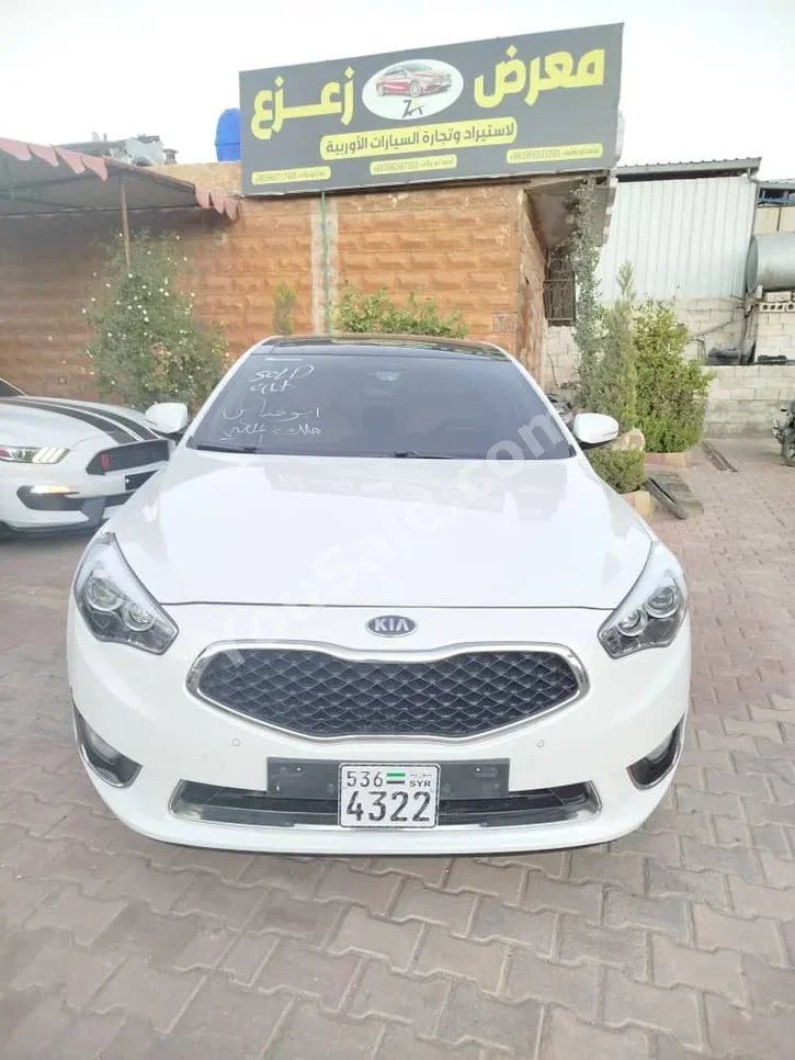 Kia  K7  2014  Automatic  81,000 km  4 Cylinder  FWD  Sedan  White  Gasoline