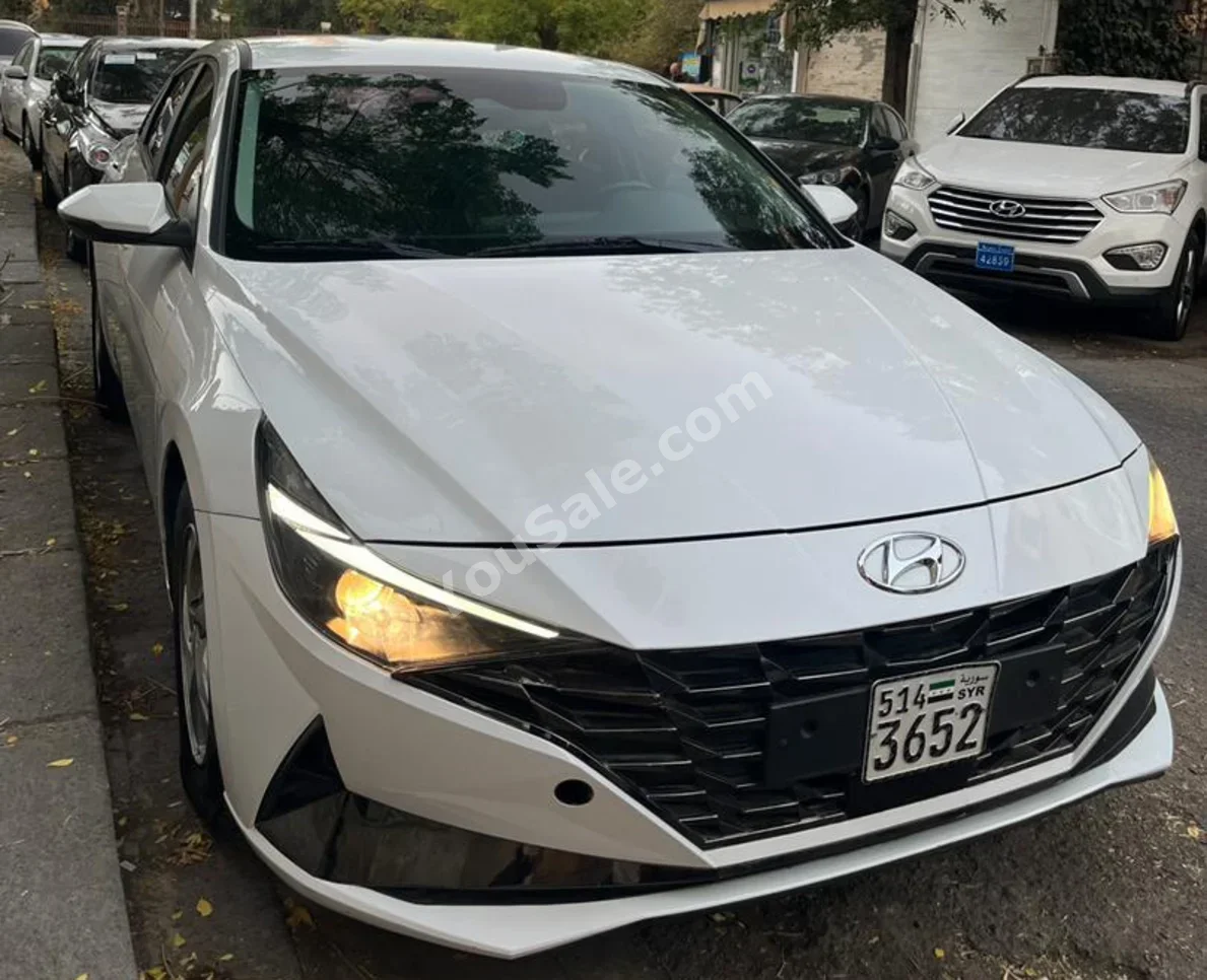 Hyundai  Elantra  2021  Automatic  165,000 km  4 Cylinder  FWD  Sedan  White  Gasoline