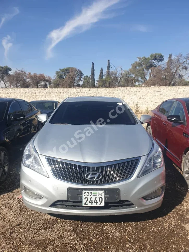 Hyundai  Grandeur  2012  Automatic  218,000 km  6 Cylinder  FWD  Sedan  Silver  Gasoline