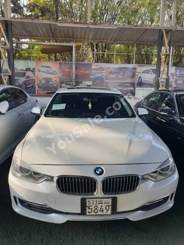 بي ام دبليو الفئة - الثالثة 328i 2013 اتوماتيك 230,000 كم 4 سلندر دفع رباعي سيدان أبيض بنزين