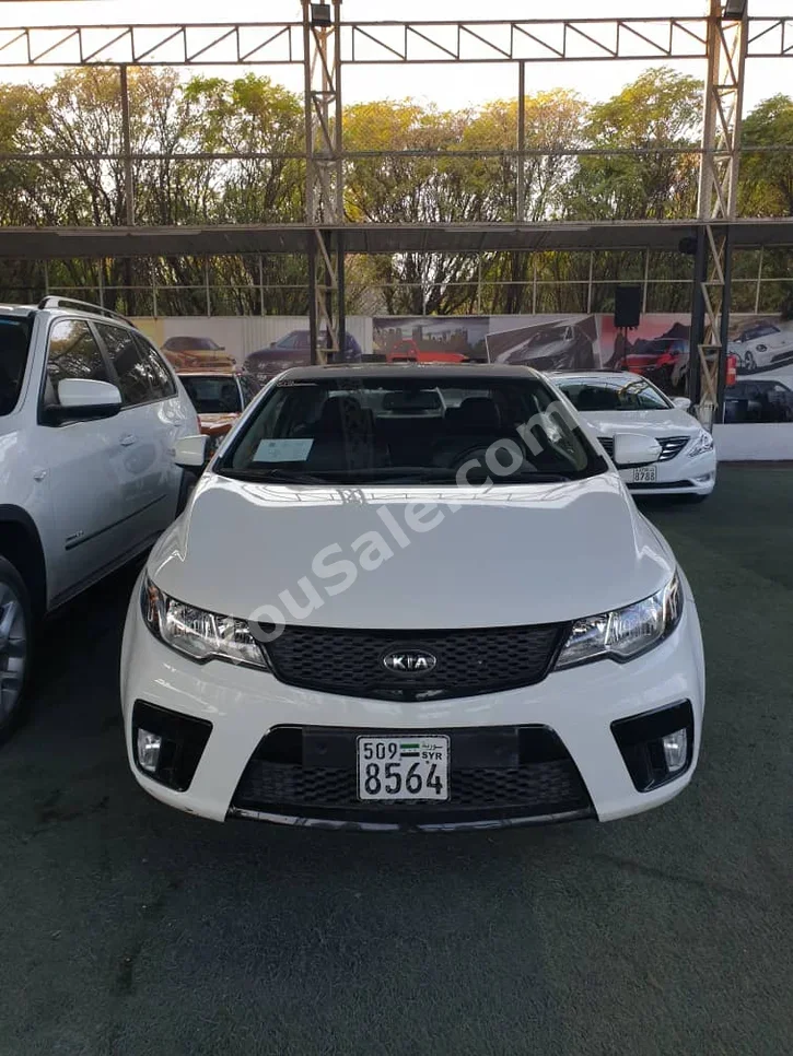 Kia Forte 2010 Automatic 186,000 km 4 Cylinder FWD Coupe / Sport White Gasoline