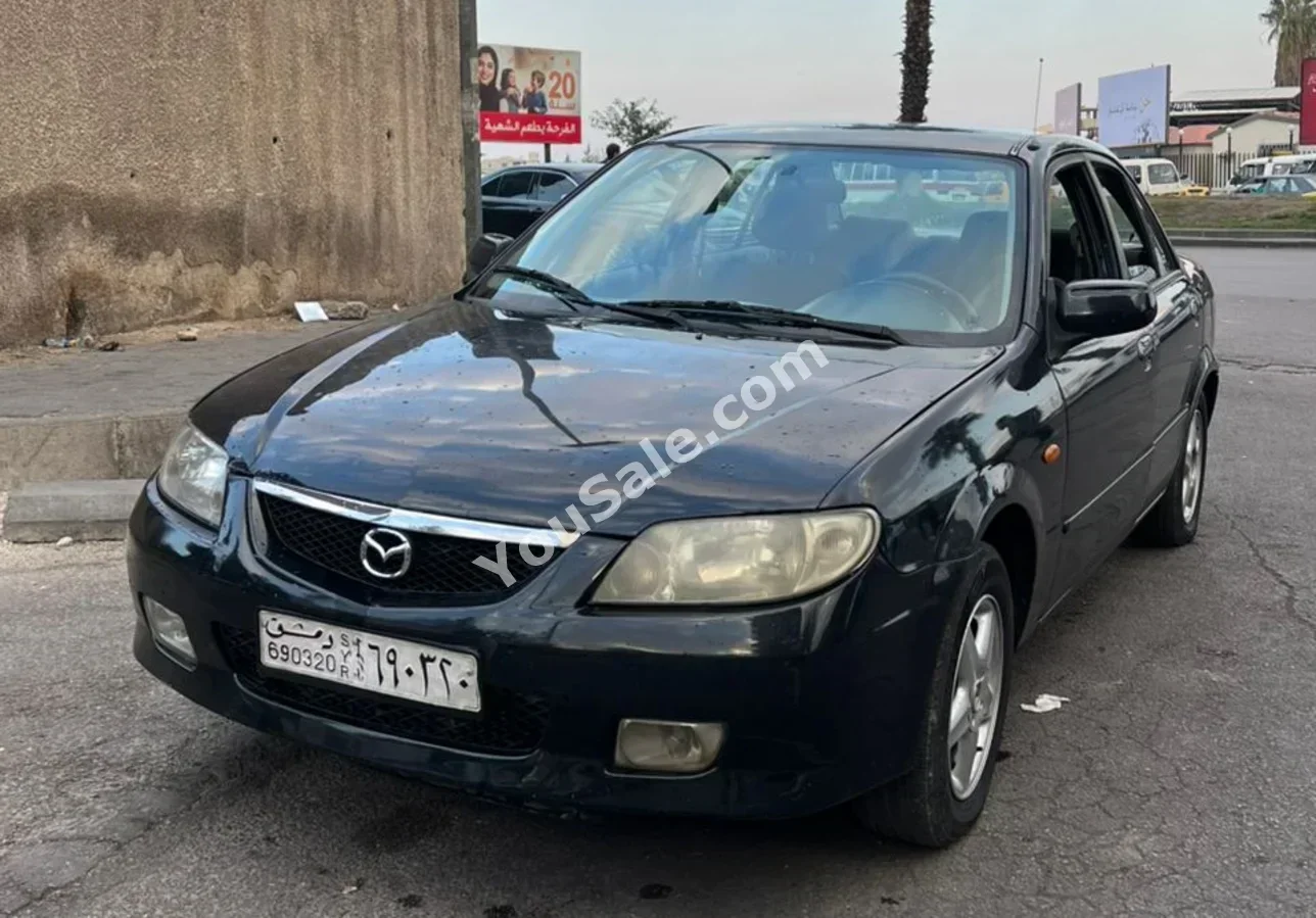 Mazda 323 2001 Automatic 177,000 km 4 Cylinder FWD Sedan Black Gasoline
