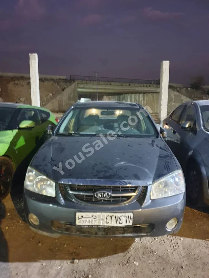 كيا سيراتو 2007 اتوماتيك 150,000 كم 4 سلندر دفع أمامي سيدان أزرق غامق بنزين