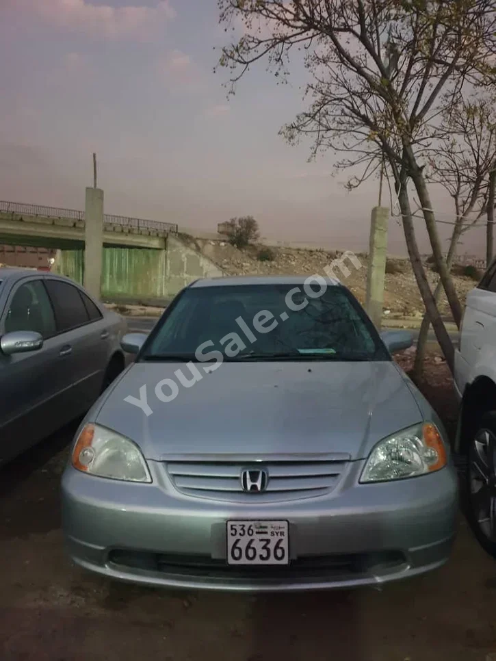 Honda  Civic  2003  Automatic  168,000 km  4 Cylinder  FWD  Sedan  Silver  Gasoline