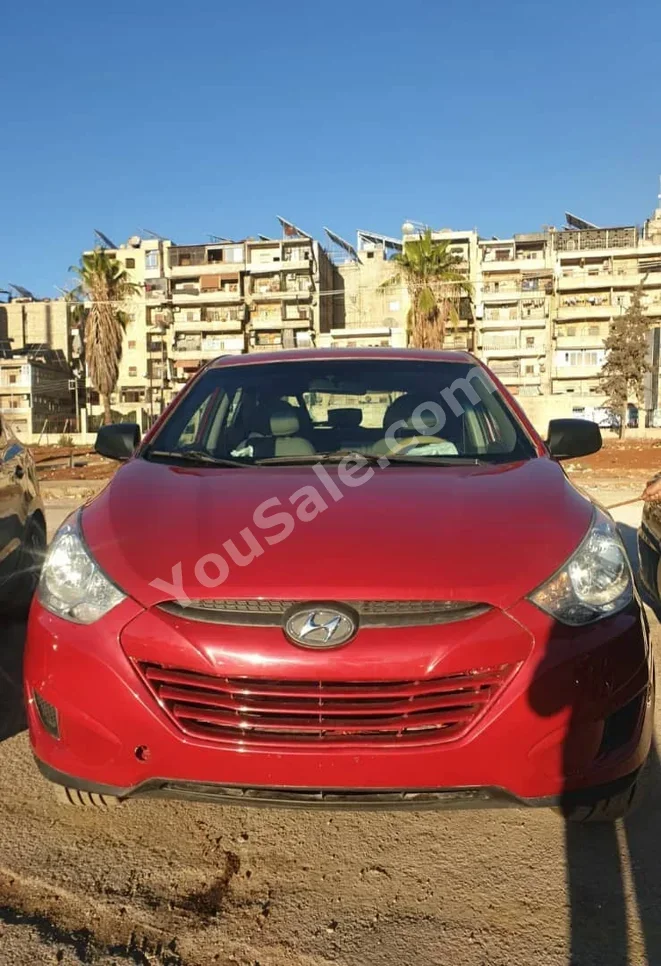Hyundai Tucson 2012 Automatic 145,000 km 4 Cylinder FWD SUV Red Gasoline