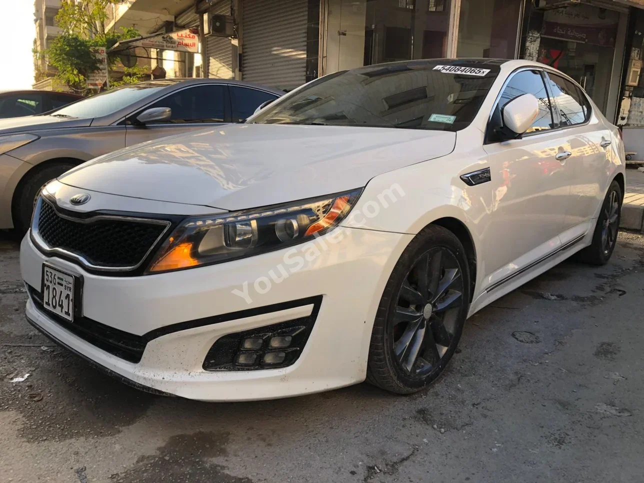 Kia  Optima  2015  Automatic  127,000 km  4 Cylinder  FWD  Sedan  White  Gasoline