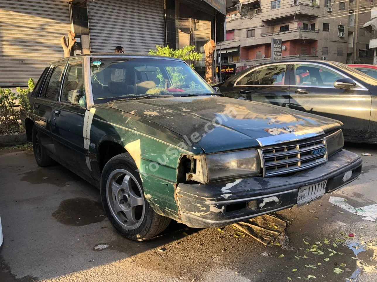 مازدا 929 1983 عادي 420,000 كم 4 سلندر دفع أمامي سيدان أخضر بنزين