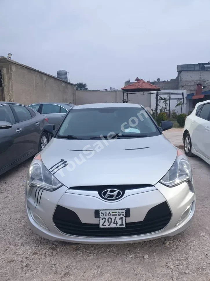 Hyundai  Veloster  2012  Automatic  179,000 km  4 Cylinder  FWD  Coupe / Sport  Silver  Gasoline