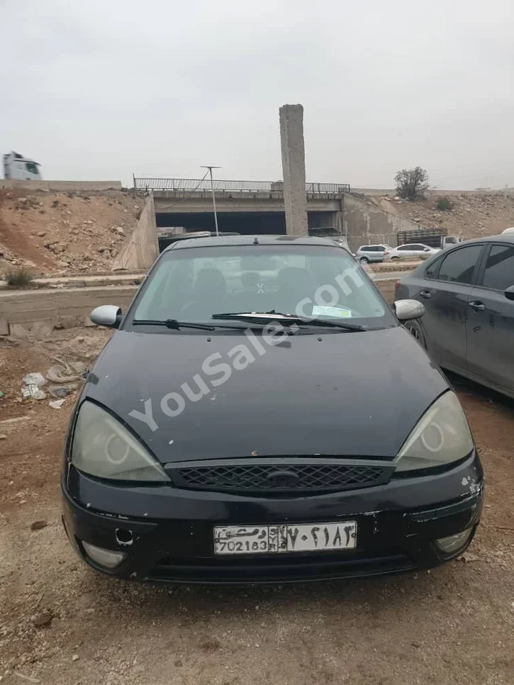 Ford  Focus  2005  Manual  134,000 km  4 Cylinder  FWD  Sedan  Black  Gasoline