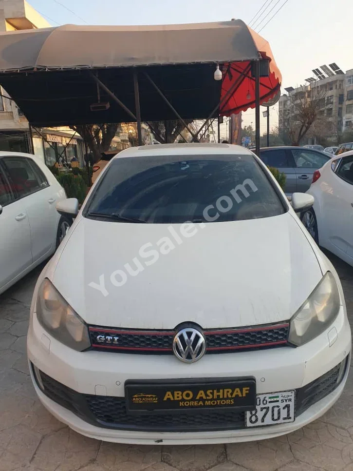 Volkswagen  Golf  GTI  2013  Automatic  140,000 km  4 Cylinder  FWD  Hatchback  White  Gasoline