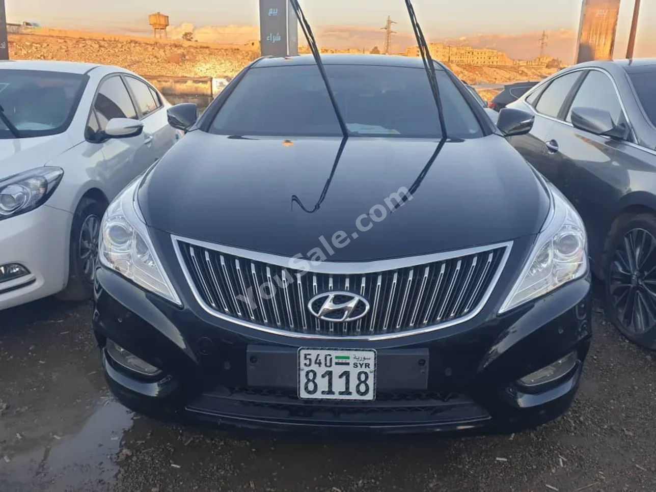 هيونداي غراندير 2013 اتوماتيك 120,000 كم 4 سلندر دفع أمامي سيدان أسود بنزين