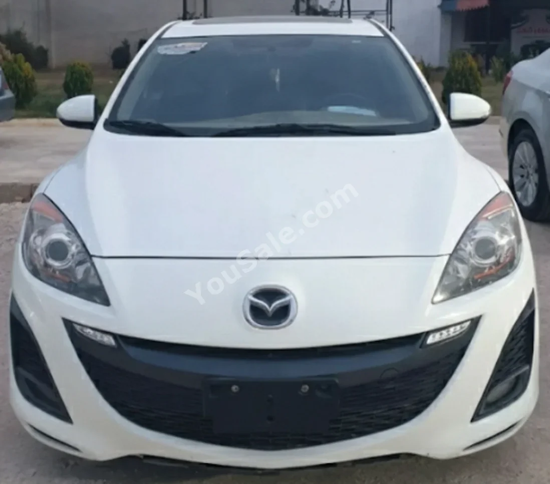 Mazda  Mazda 3  2013  Automatic  150,000 km  4 Cylinder  FWD  Hatchback  White  Gasoline