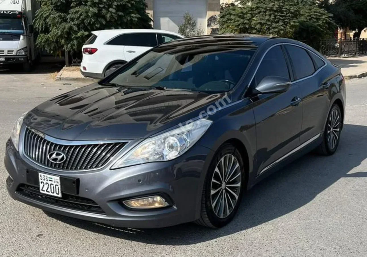 Hyundai  Azera  2014  Automatic  133,000 km  4 Cylinder  FWD  Sedan  Gray  Gasoline