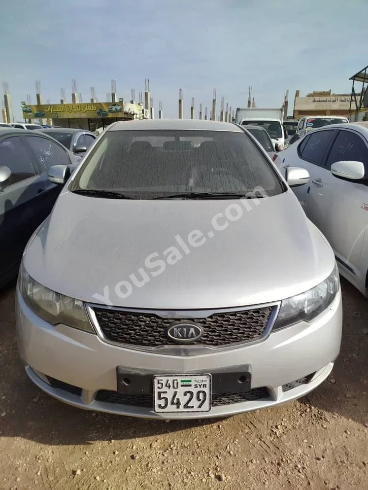 Kia  Forte  2012  Automatic  96,000 km  4 Cylinder  FWD  Sedan  Silver  Gasoline