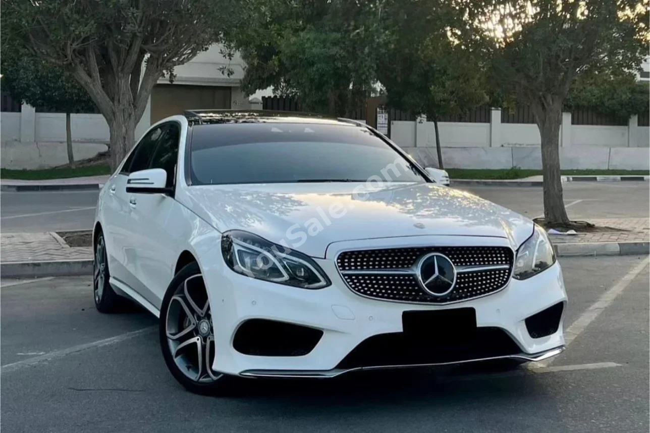 Mercedes-Benz  E-Class  400  2013  Automatic  77,000 km  6 Cylinder  RWD  Sedan  White  Gasoline