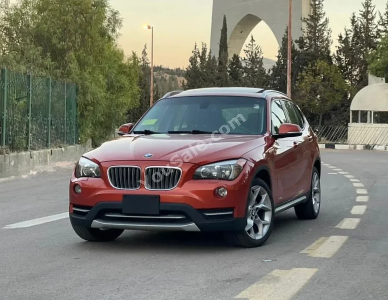 BMW  X-Series  1  2014  Automatic  175,000 km  4 Cylinder  RWD  SUV  Orange  Gasoline