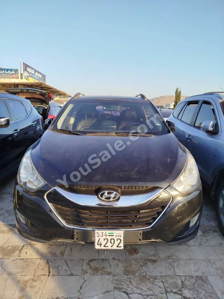 Hyundai  Tucson  2011  Automatic  150,000 km  4 Cylinder  FWD  SUV  Black  Diesel