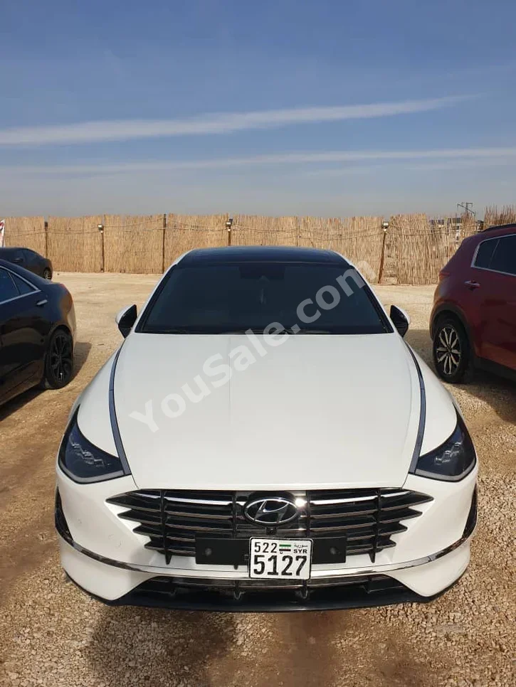 Hyundai  Sonata  2019  Automatic  102,000 km  4 Cylinder  FWD  Sedan  White  Gasoline