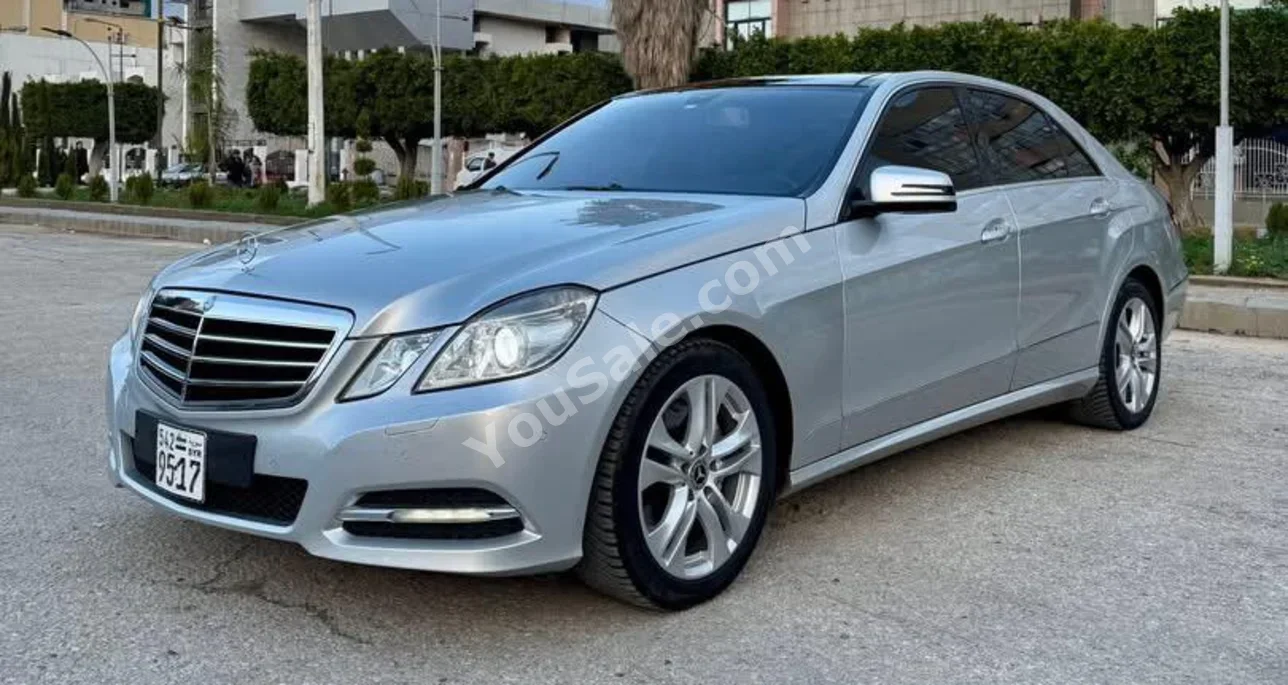 Mercedes-Benz  E-Class  300  2011  Automatic  110,000 km  6 Cylinder  RWD  Sedan  Silver  Gasoline
