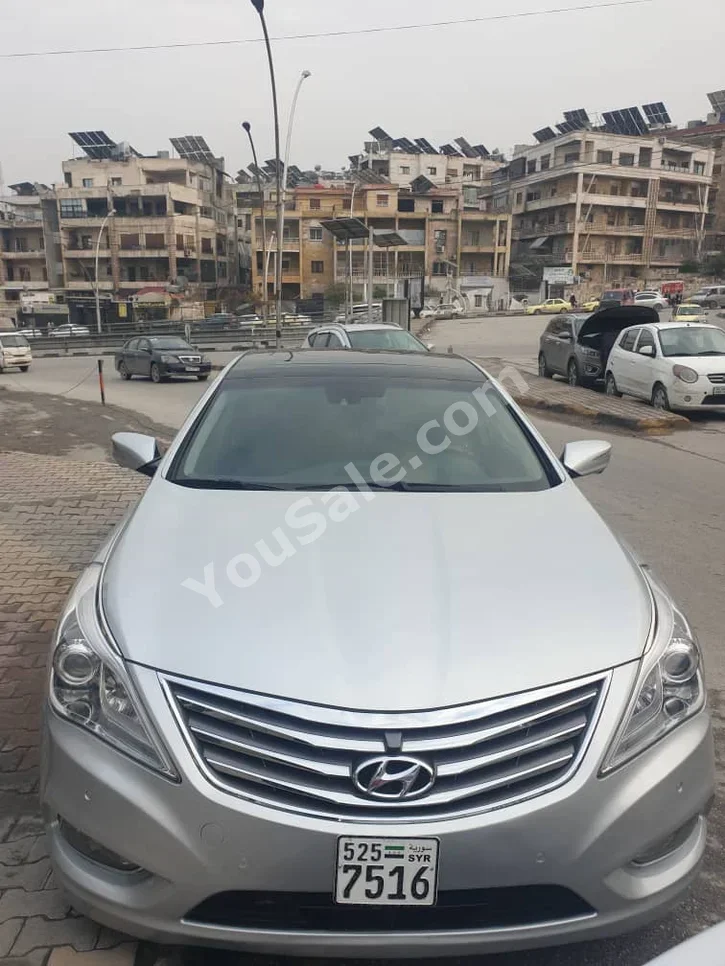Hyundai  Grandeur  2012  Automatic  150,000 km  4 Cylinder  FWD  Sedan  Silver  Gasoline
