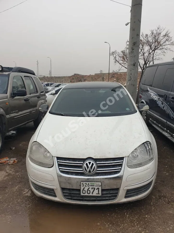 Volkswagen  Jetta  2012  Automatic  125,000 km  4 Cylinder  FWD  Sedan  White  Diesel