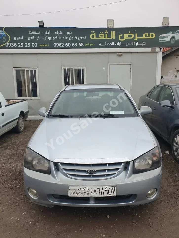 Kia  Spectra  2003  Automatic  266,000 km  4 Cylinder  FWD  Sedan  Silver  Gasoline