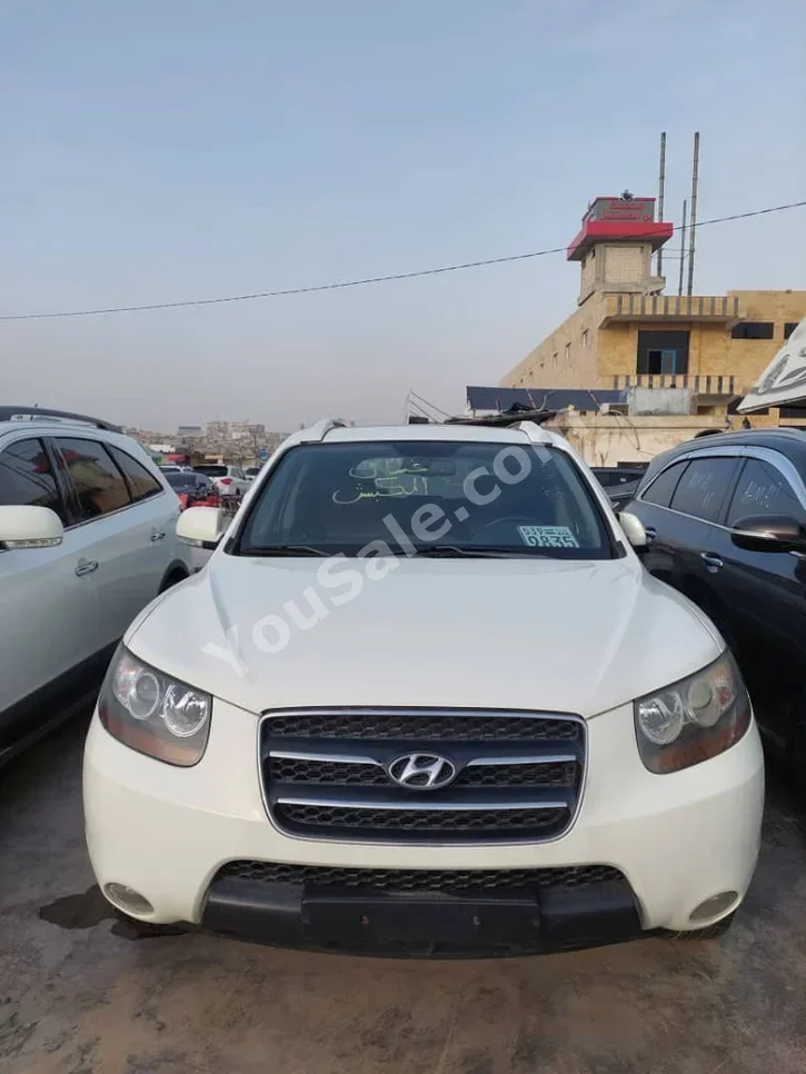 Hyundai  Santa Fe  2009  Automatic  174,000 km  4 Cylinder  FWD  SUV  White  Diesel