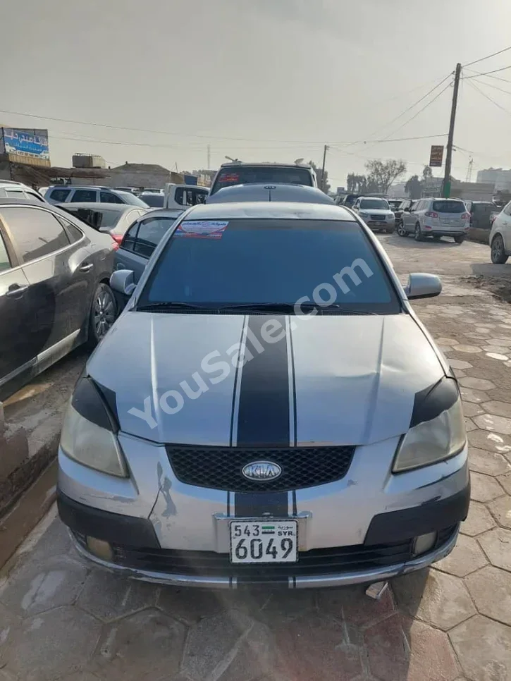 Kia  Pride  2006  Automatic  182,000 km  4 Cylinder  FWD  Sedan  Silver  Gasoline