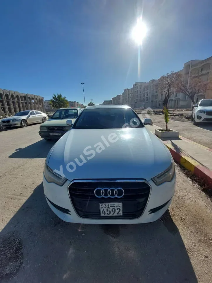 اودي أي 6 2.0 T 2011 اتوماتيك 138,000 كم 4 سلندر دفع خلفي سيدان أبيض بنزين