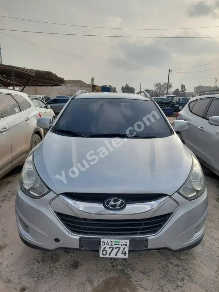 Hyundai Tucson 2011 Automatic 123,000 km 4 Cylinder FWD SUV Silver Diesel