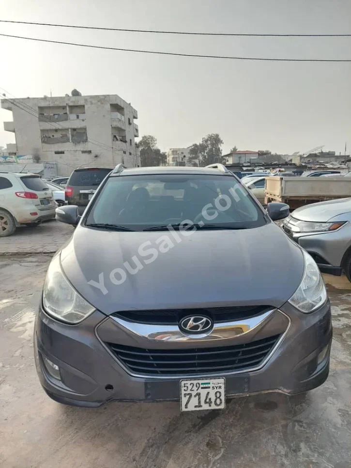 Hyundai  Tucson  2010  Automatic  177,000 km  4 Cylinder  FWD  SUV  Dark Gray  Gasoline