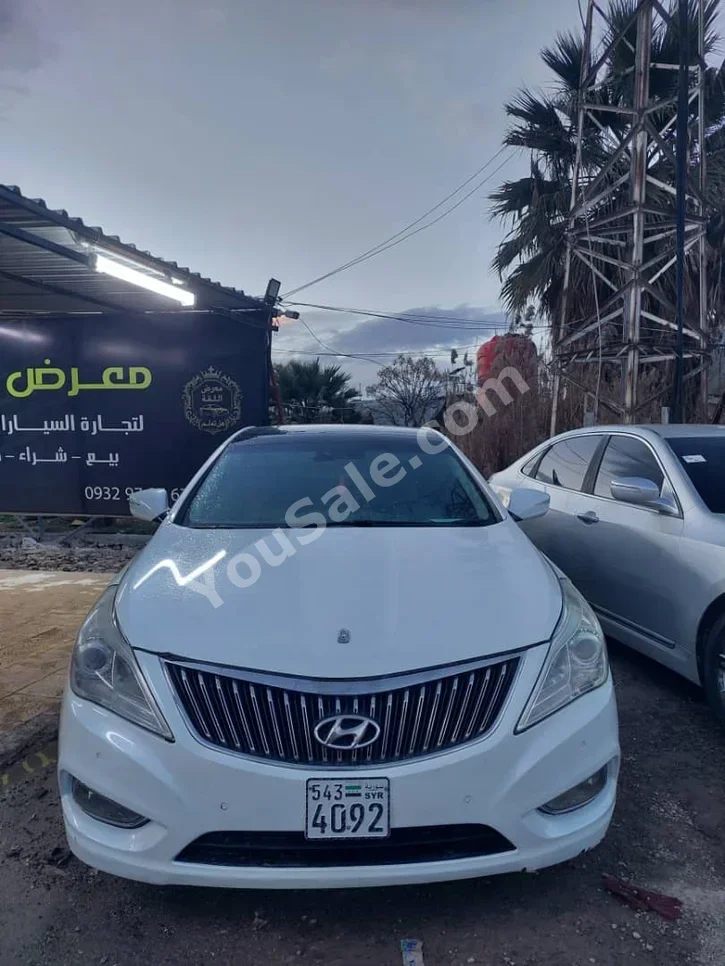 Hyundai  Grandeur  2012  Automatic  120,000 km  4 Cylinder  FWD  Sedan  White  Gasoline