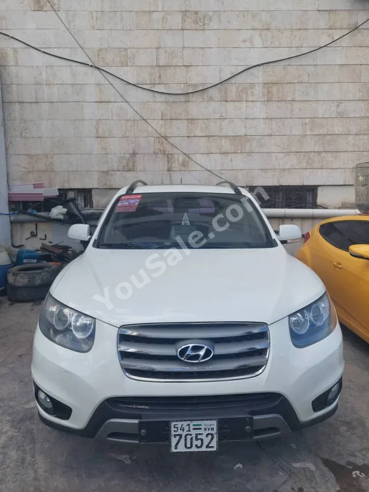 Hyundai  Santa Fe  2012  Automatic  177,000 km  4 Cylinder  FWD  SUV  White  Diesel
