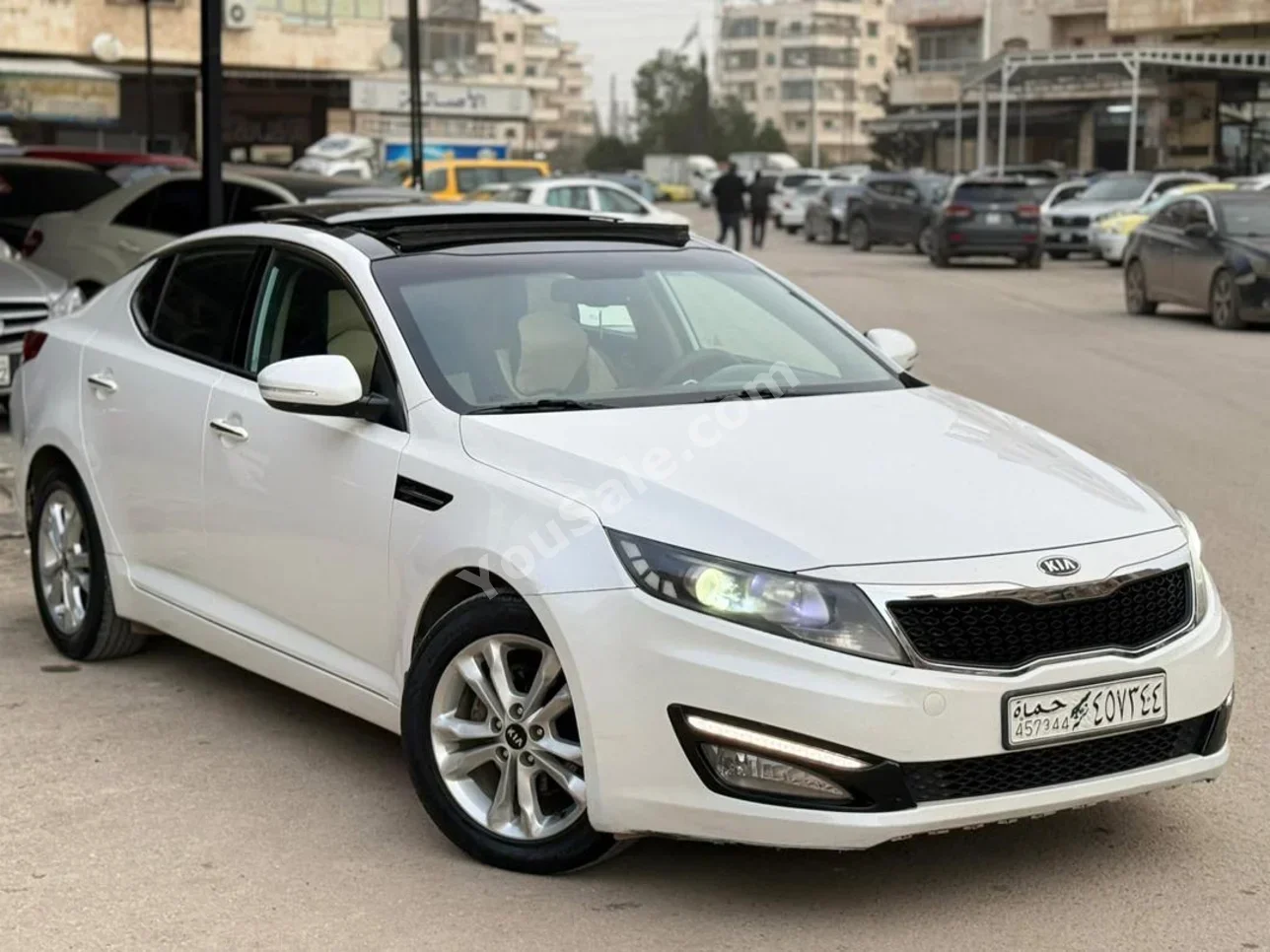 Kia  Optima  2011  Automatic  171,000 km  4 Cylinder  FWD  Sedan  White  Gasoline