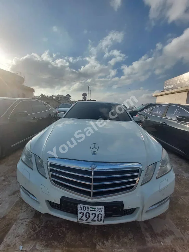 Mercedes-Benz  E-Class  220  2011  Automatic  112,000 km  6 Cylinder  RWD  Sedan  White  Gasoline