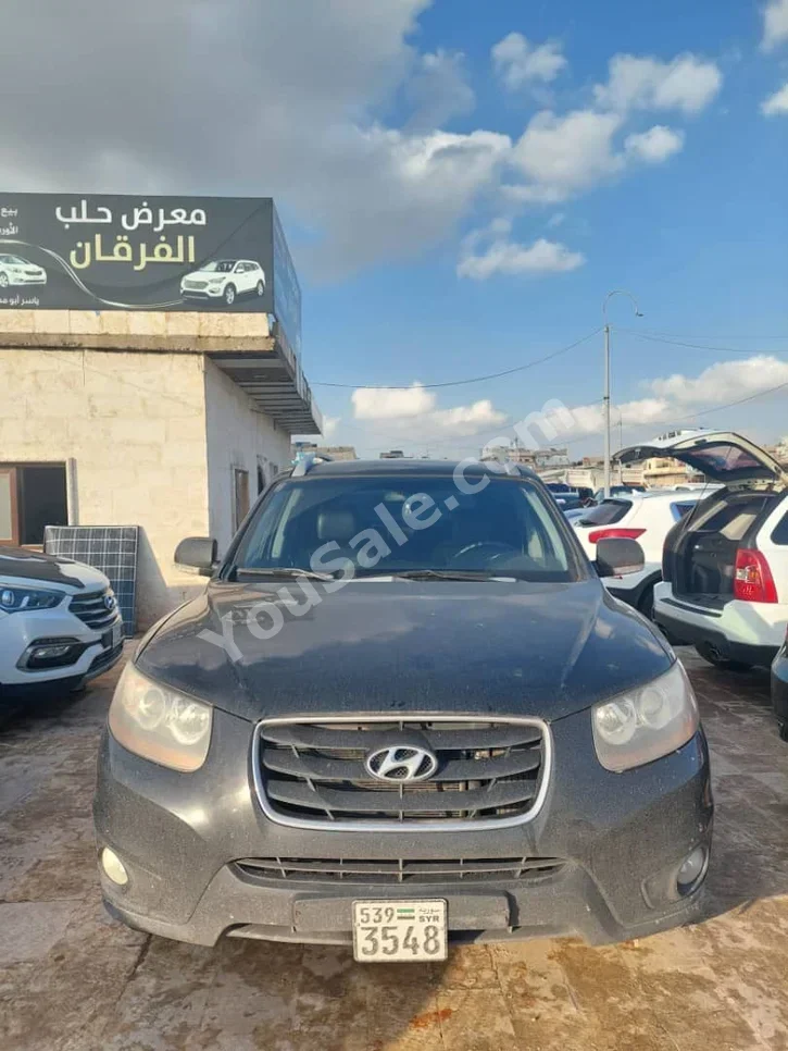 Hyundai  Santa Fe  2009  Automatic  115,000 km  4 Cylinder  FWD  SUV  Black  Diesel