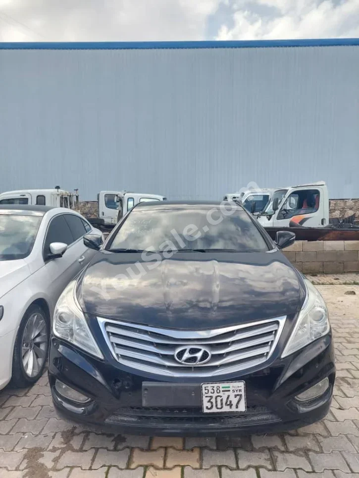 Hyundai  Grandeur  2012  Automatic  124,000 km  4 Cylinder  FWD  Sedan  Black  Gasoline