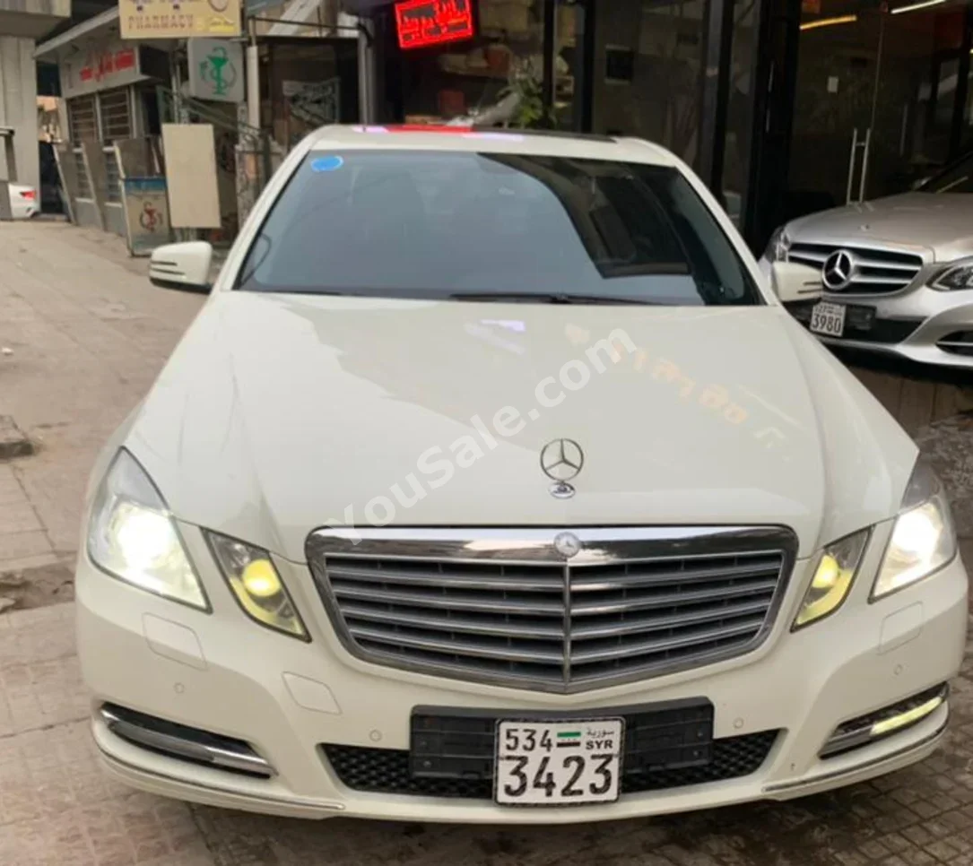 Mercedes-Benz  E-Class  300  2011  Automatic  200,000 km  6 Cylinder  RWD  Sedan  White  Gasoline