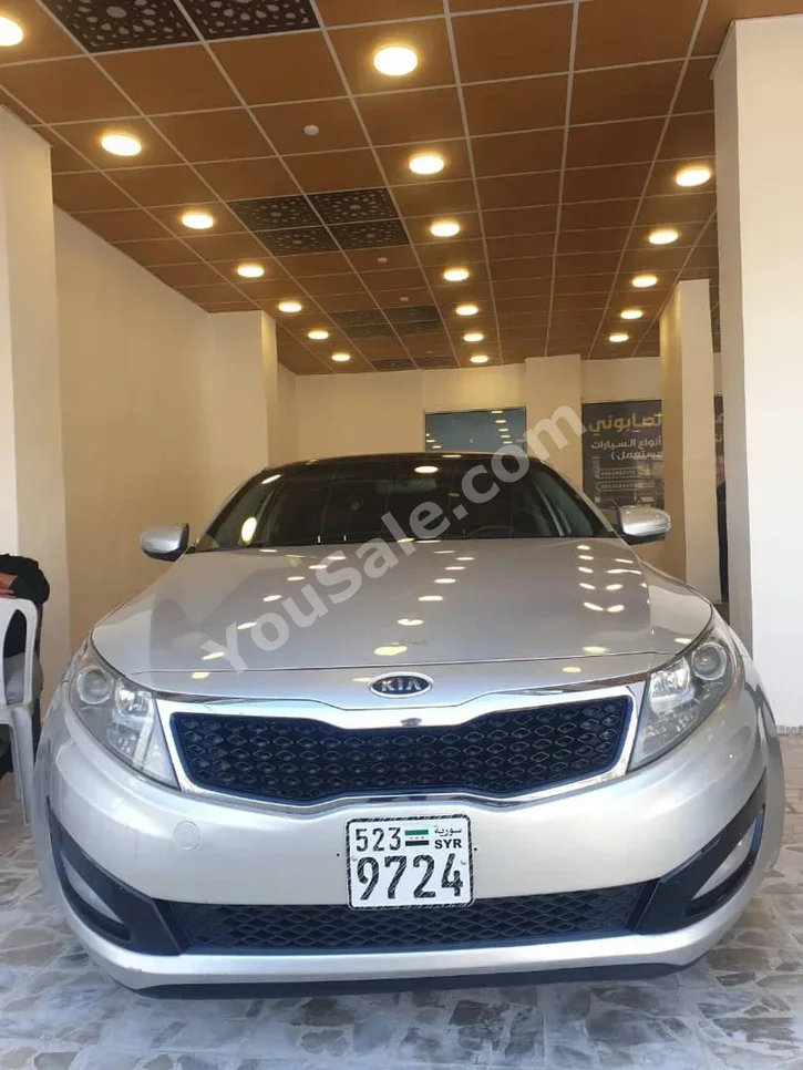 Kia  Optima  2012  Automatic  260,000 km  4 Cylinder  FWD  Sedan  Silver  Gasoline