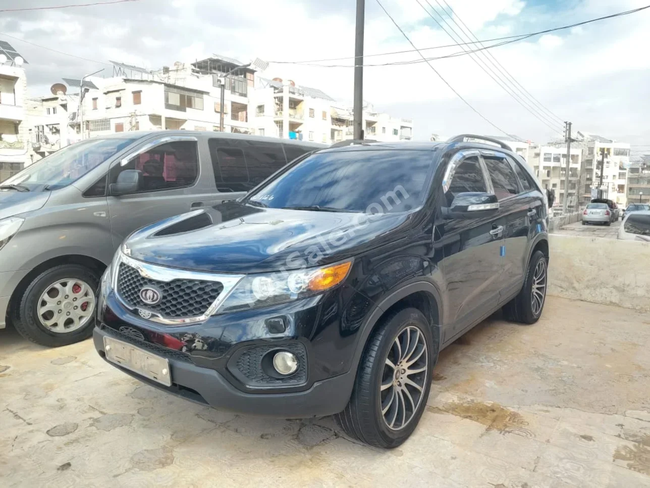 Kia  Sorento  2010  Automatic  135,000 km  4 Cylinder  FWD  SUV  Black  Gasoline